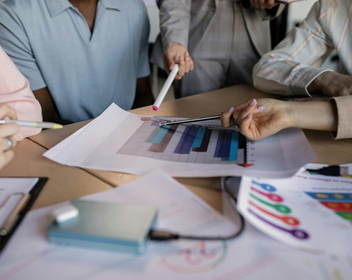 group of employees discussing business performance