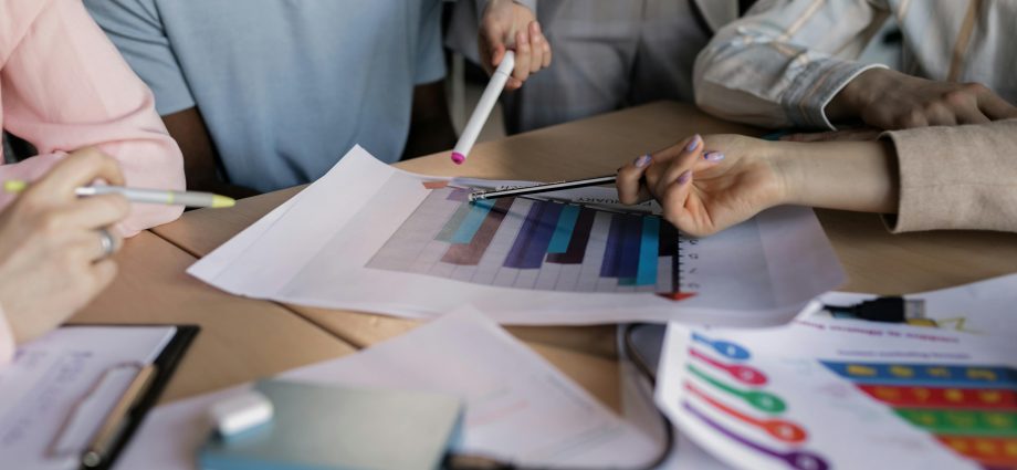 group of employees discussing business performance